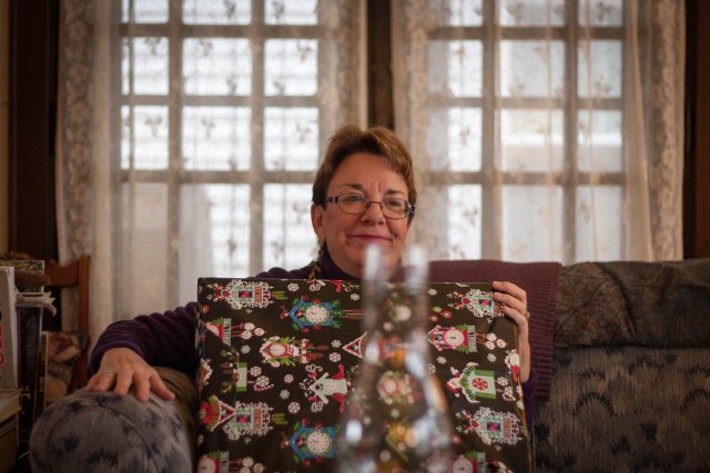 Merilee Miller opening a present
